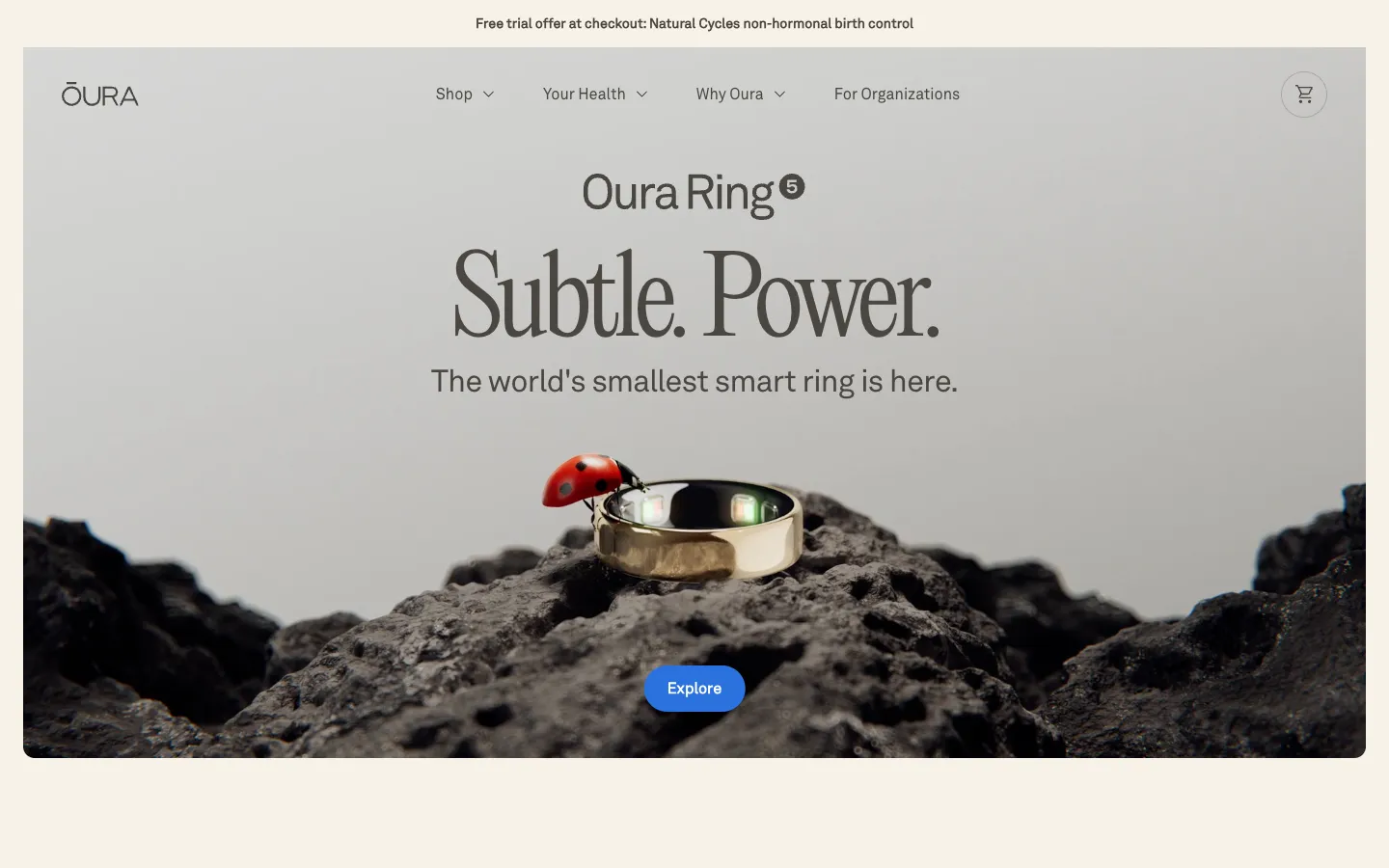 Oura home page: Oura Ring 5, Subtle. Power. The world's smallest smart ring, a ring on dark stone with a ladybird